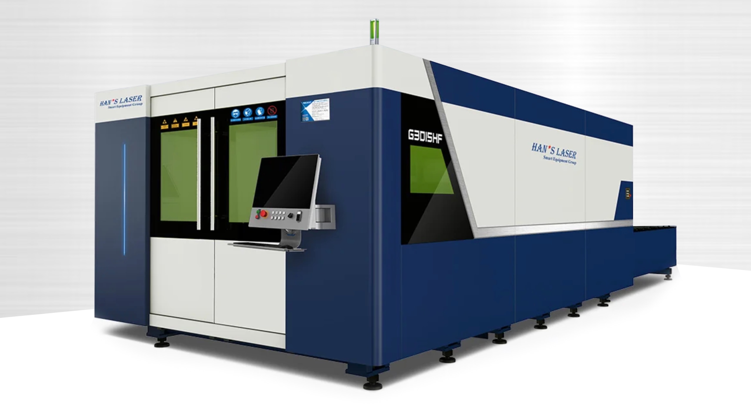 Industrial fiber laser cutting machine with blue laser beam cutting through metal sheet, showing precision manufacturing equipment in modern factory setting